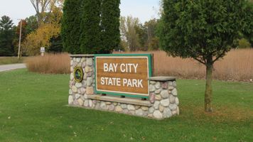 Sign at the entrance to Bay City State Park on Road M-247